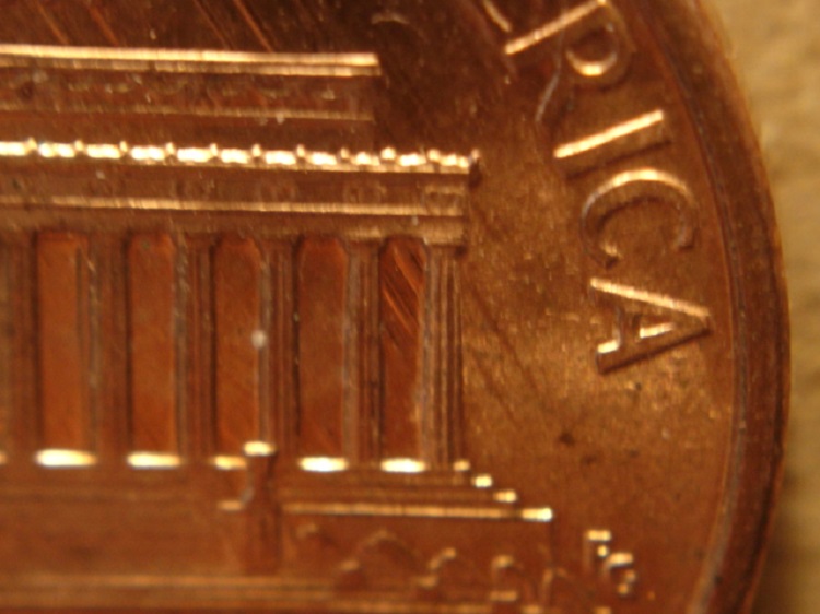 1994-P-LMC:-Die-Scrapes-From-Feeder-Finger-Damage-On-Reverse.
